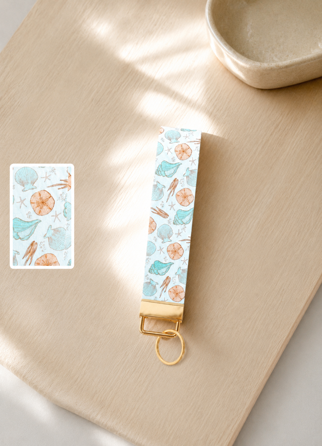 Keychain with ocean-themed design on a wooden surface