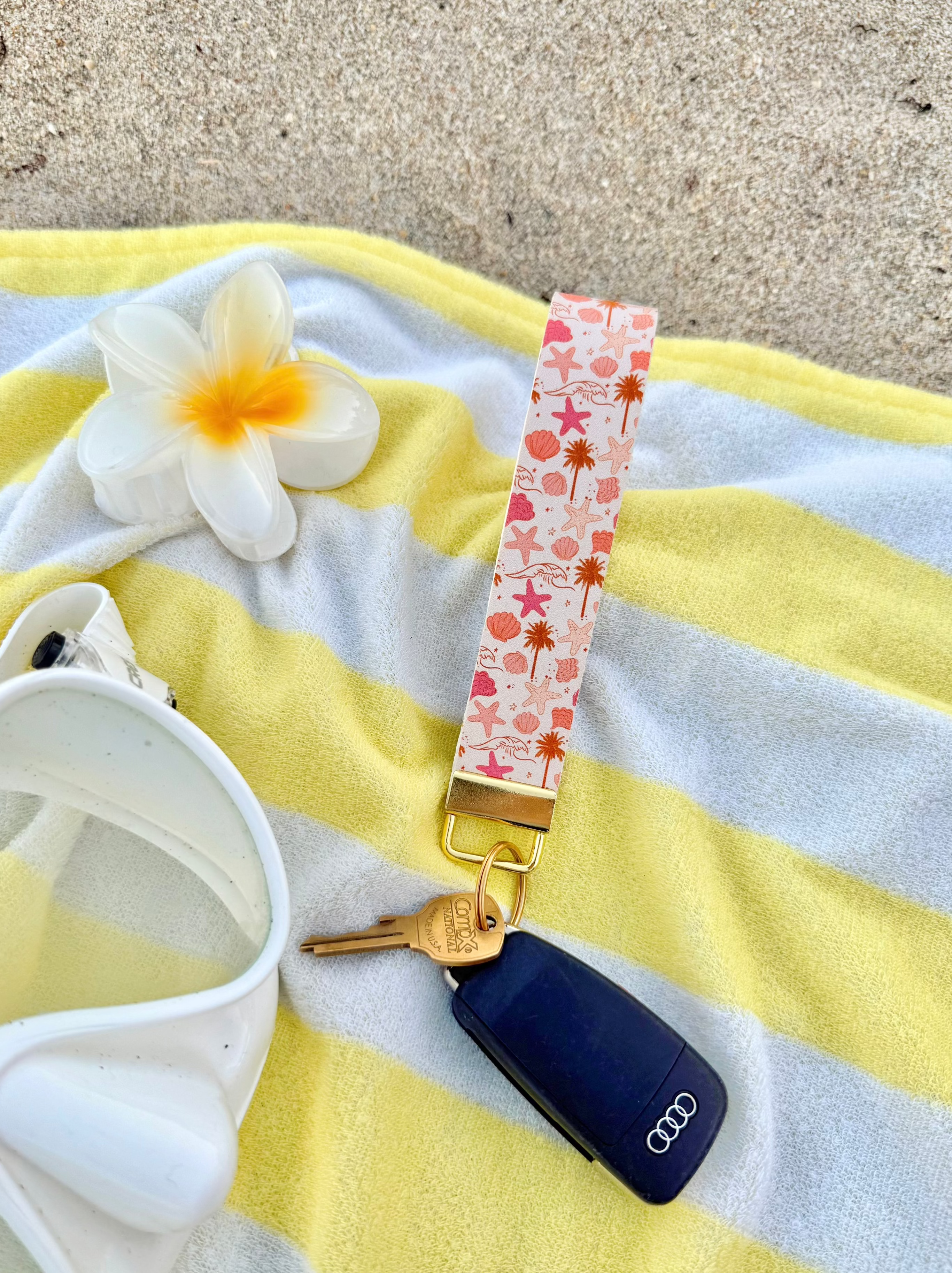 Beach Babe wristlet keychain held on wrist with gold hardware — coastal accessory for women
